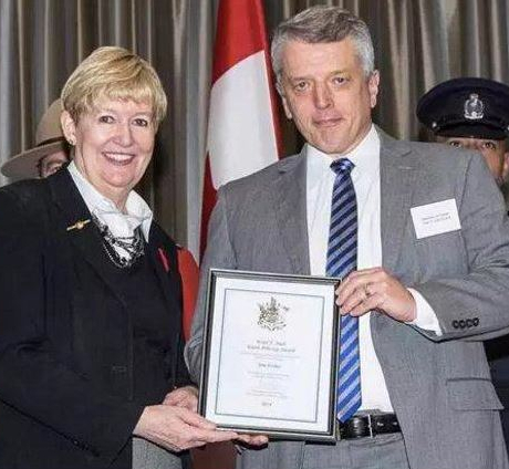 Attorney general-minister of justice Suzanne Anton celebrates Vancouver police creep Jim Fisher